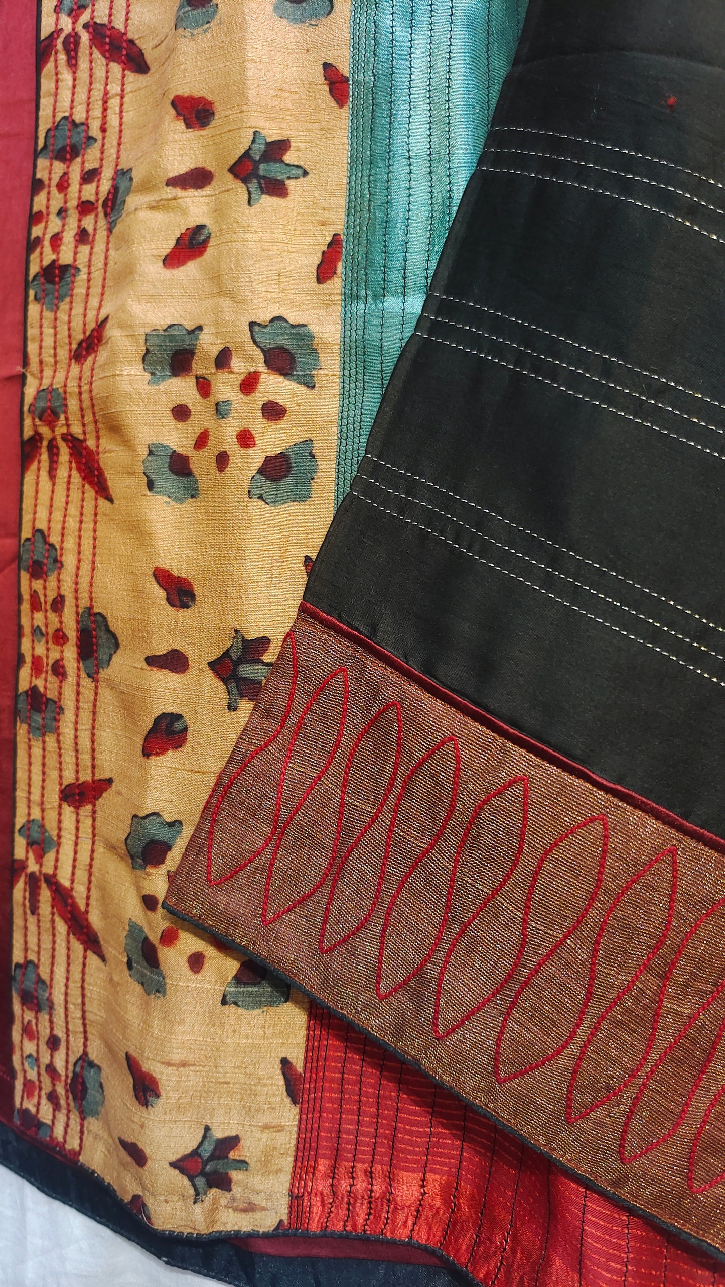 Close-up of a patchwork quilt with various colored jacket and patterns.