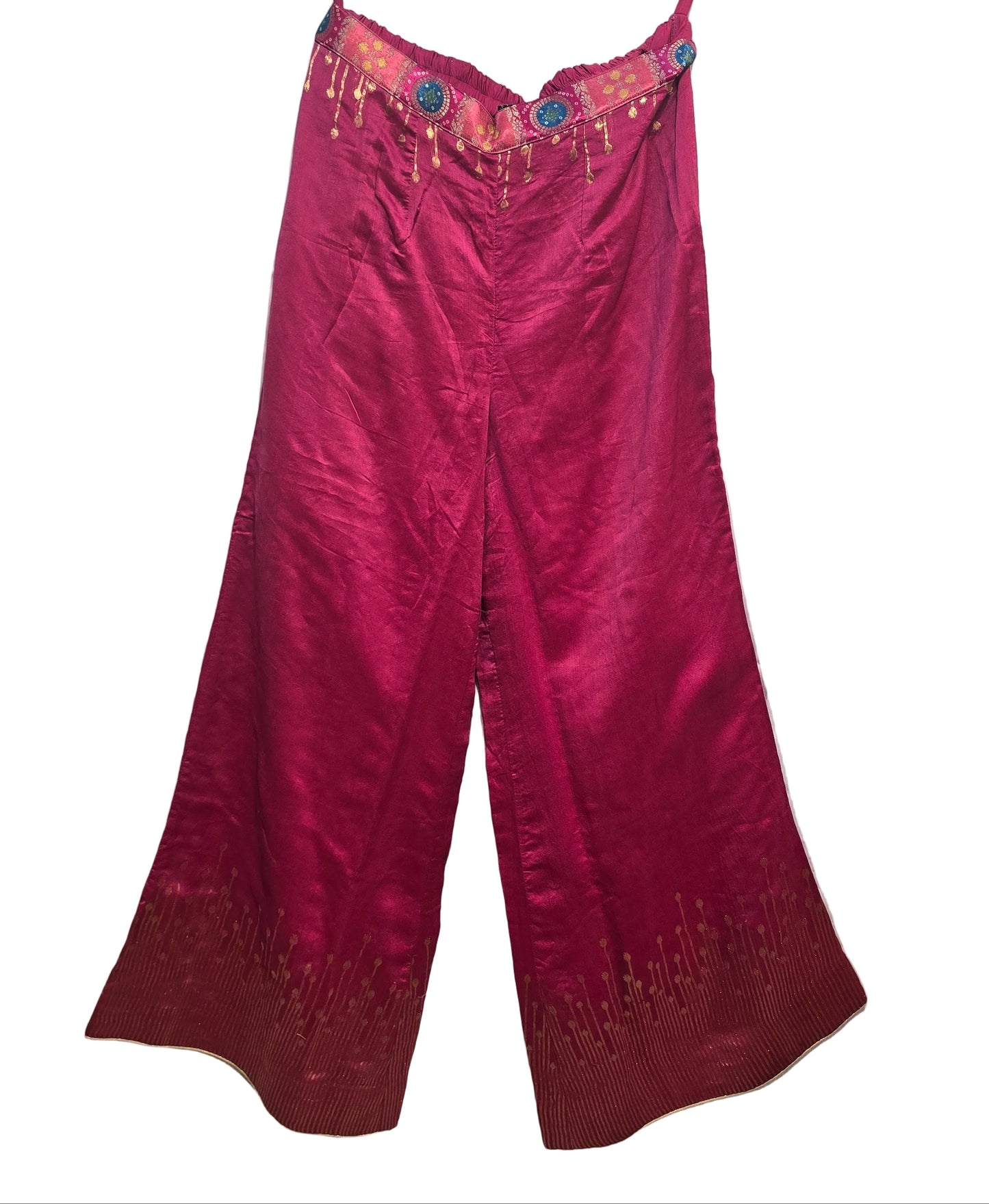 Pink  plazzo pant with floral embellishments on a white background