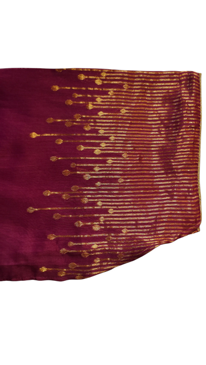 Maroon fabric with gold embroidery on a white background