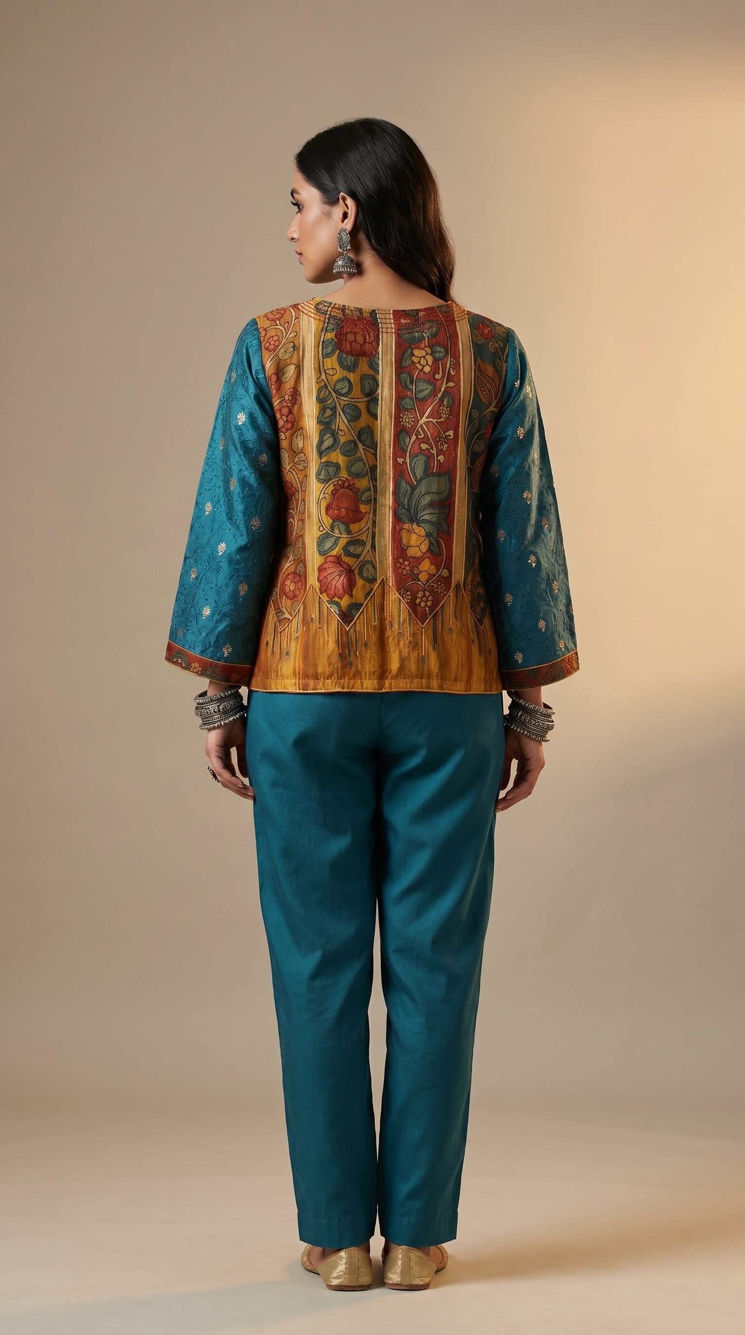 Woman wearing a traditional outfit with a colorful back design on a beige background