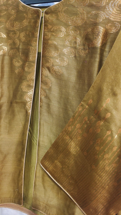 Close-up of a textured gold jacket with patterns