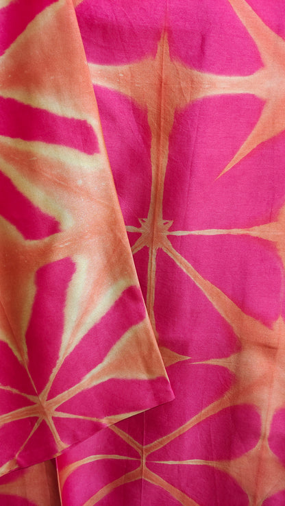Pink and orange tie-dye fabric pattern