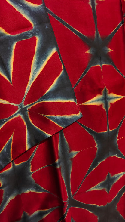 Red fabric with black starburst pattern
