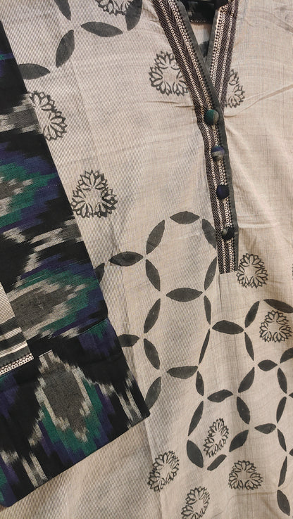 Textile with geometric pattern and colorful accents on a neutral background