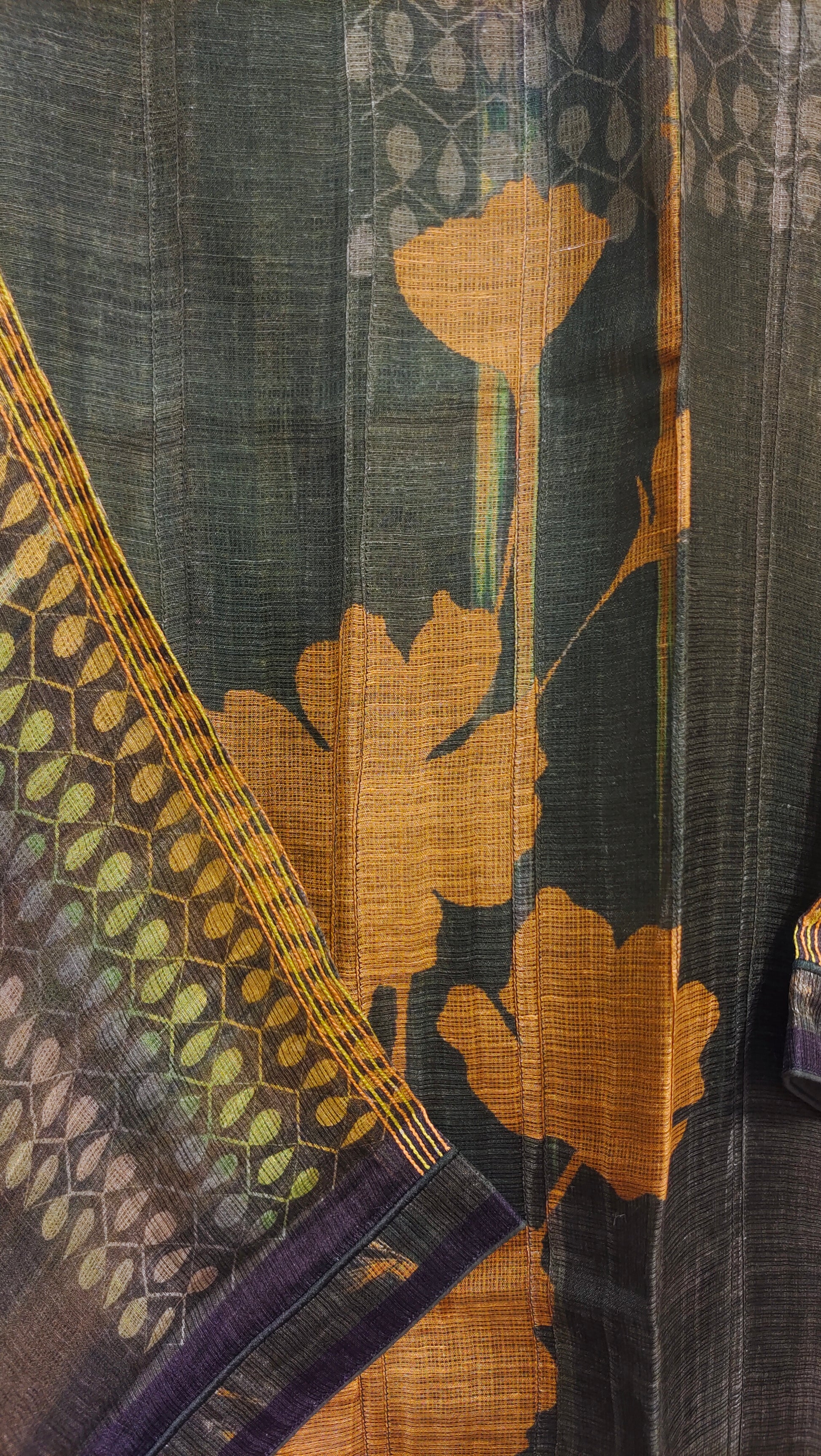 Close-up of a fabric with floral patterns and a dark background
