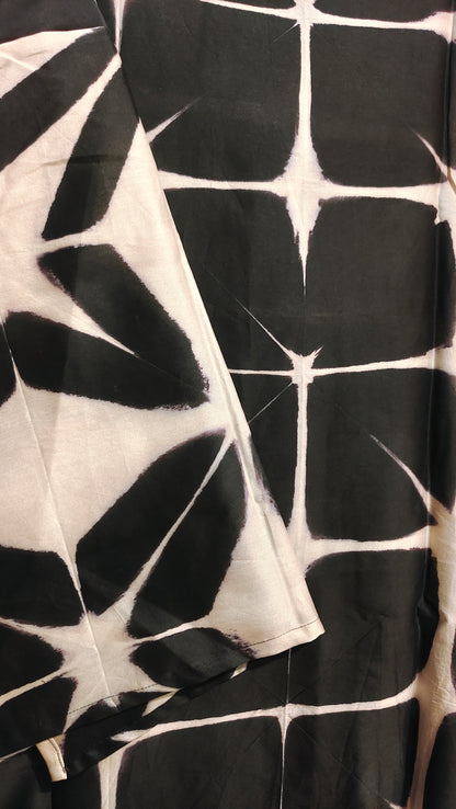 Black and white patterned fabric with a diamond design