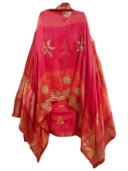 Red traditional suit with gold embroidery on a white background