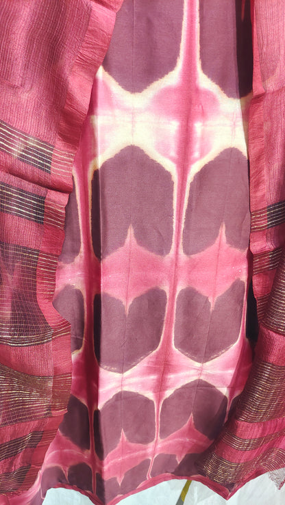 Close-up of a red patterned kurta with a white background
