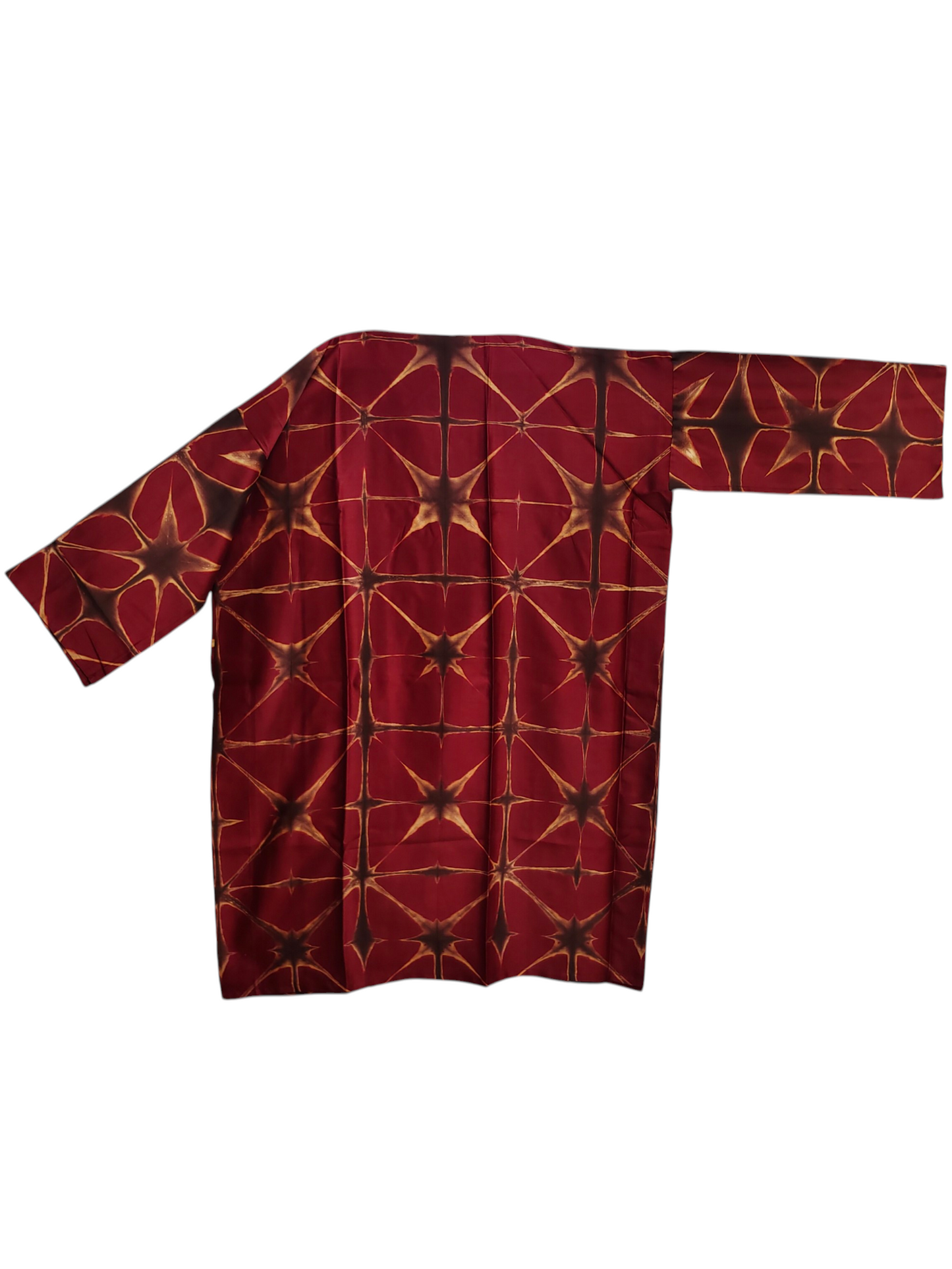 Red garment with geometric pattern on a white background