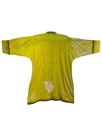 Green long-sleeve shirt white pattern on a white background
