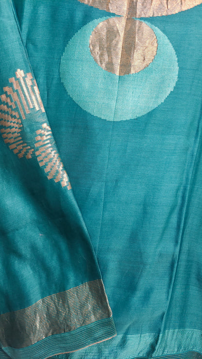 Teal fabric with gold embroidery and patterns