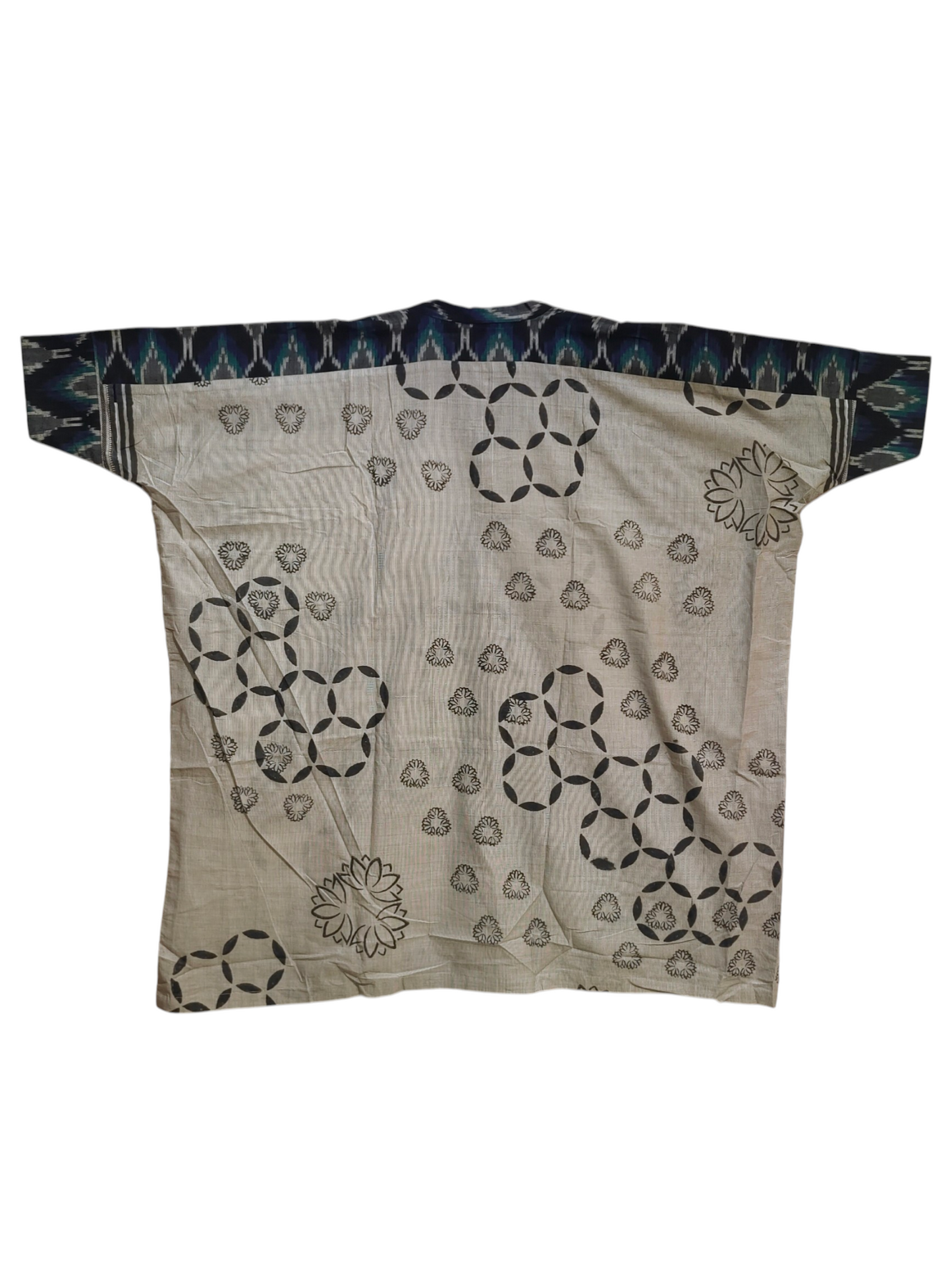 Beige tunic with black geometric patterns on a white background