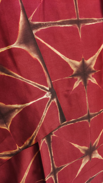 Red fabric with brown abstract pattern