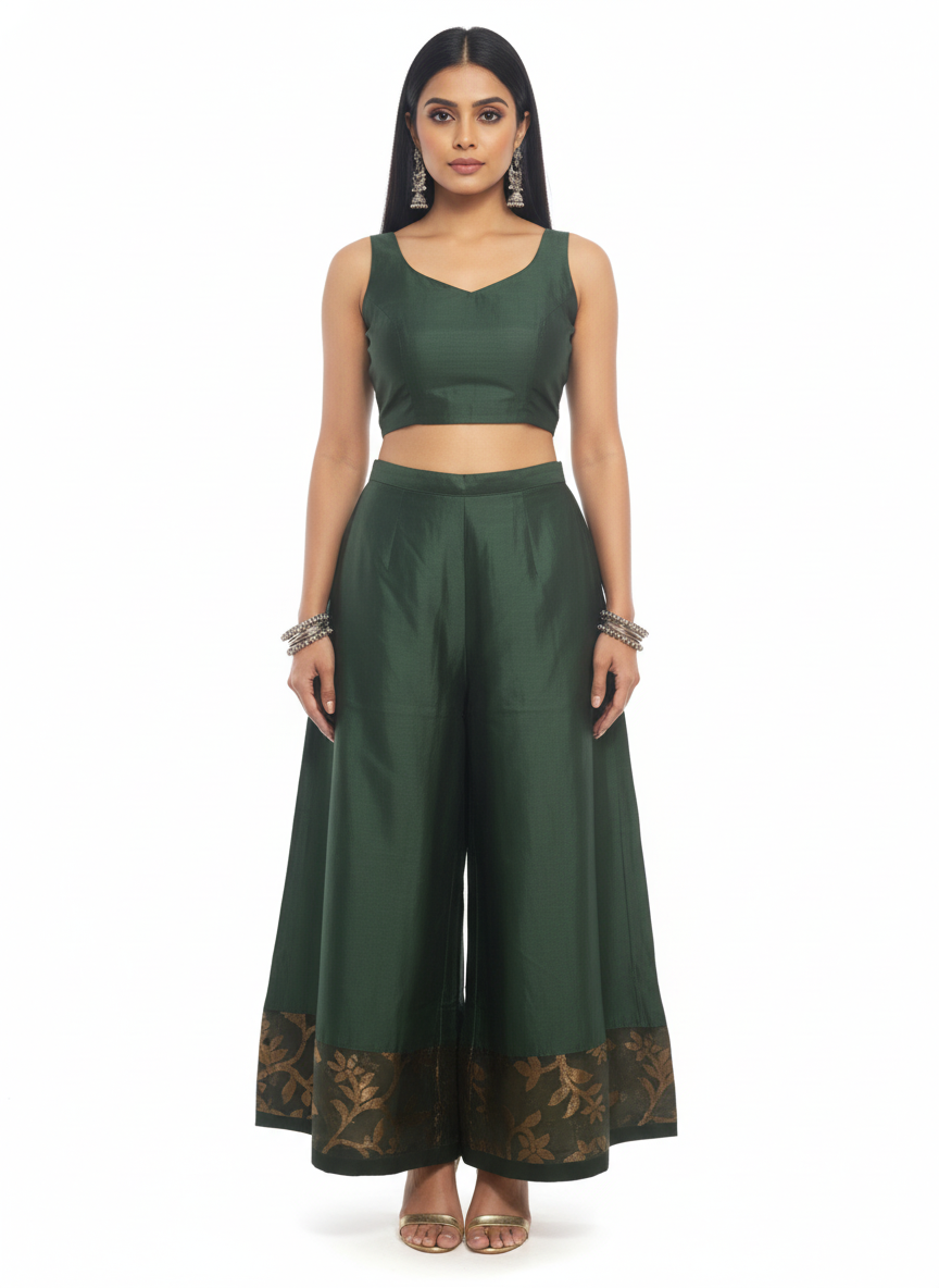 Woman wearing a green outfit with a matching top and plazzo pant on a white background