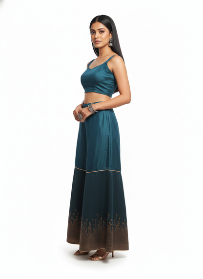 Woman wearing a teal traditional plazzo pant on a white background