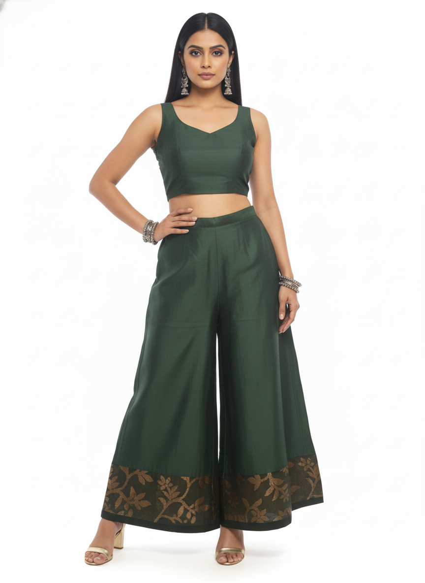 Woman wearing a green plazzo pant a white background