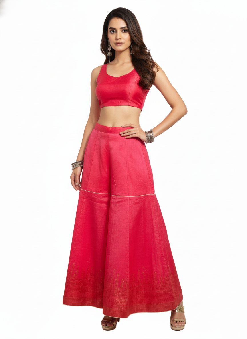 Woman wearing a pink plazzo pant on a white background