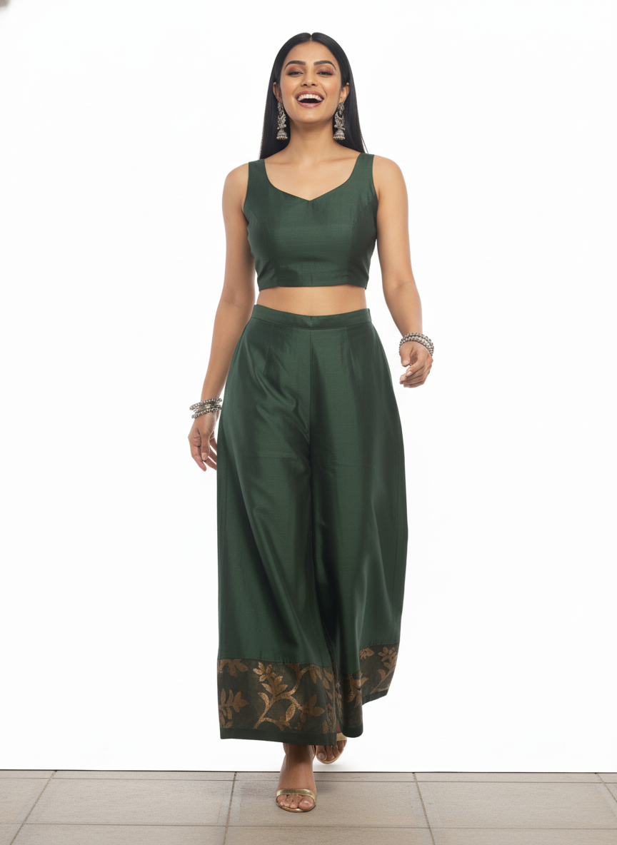 Woman wearing a green plazzo pant on a white background