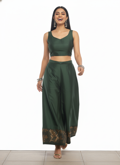 Woman wearing a green plazzo pant on a white background