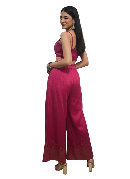 Woman wearing a pink plazzo pant with on a white background