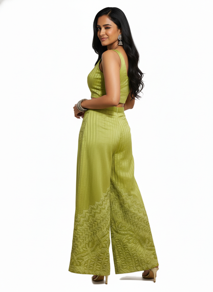 Woman wearing a green plazzo a white background