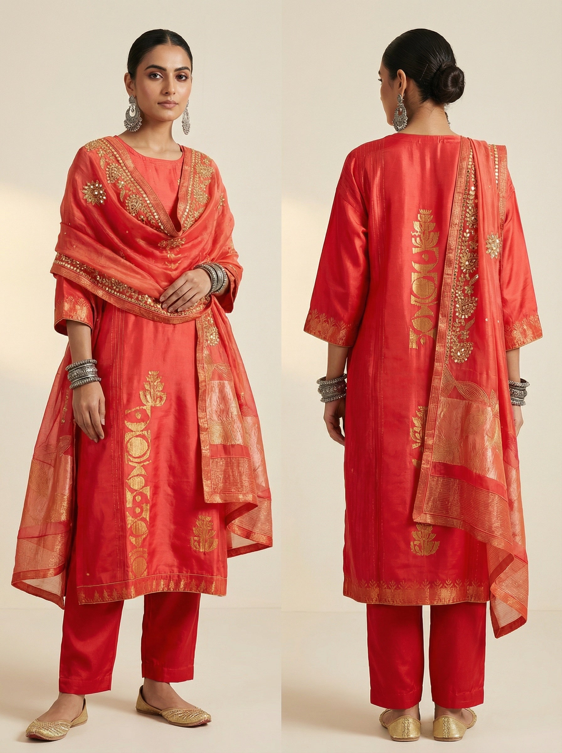 Pink traditional suit with gold embroidery on a plain background